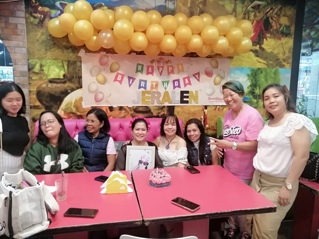 Barkada birthday party gathered around cakes at Sweet Pepper