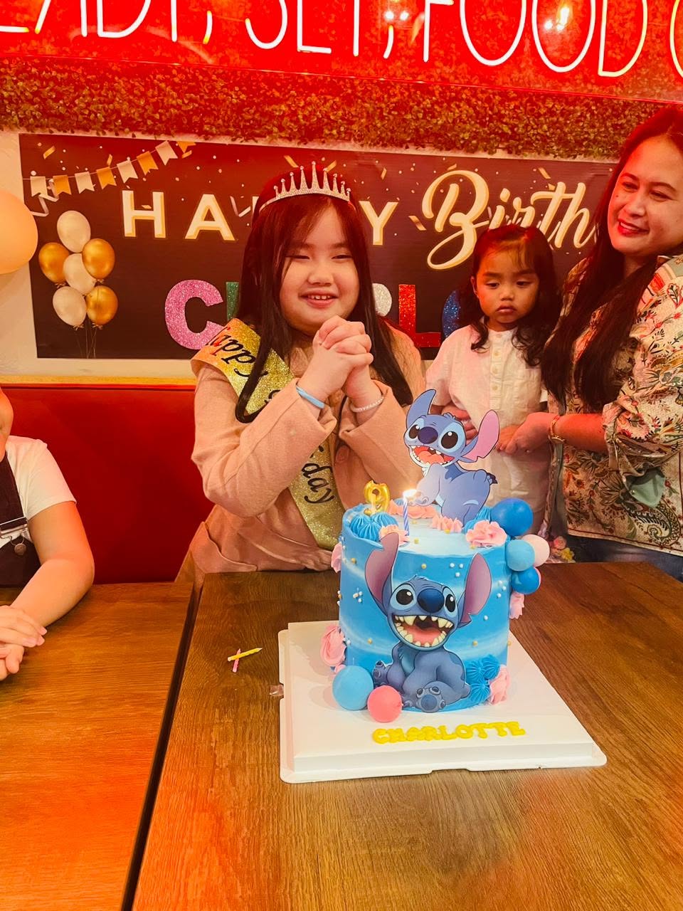 Birthday girl with her Stitch cake at Sweet Pepper Dubai
